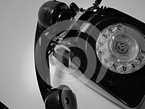 A vintage and antique telephone with white background. photo